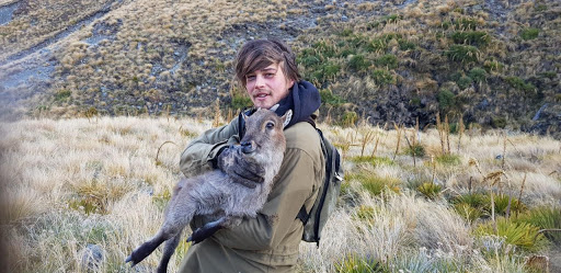 Alister with a young tahr he caught live for a quick photo shoot, before releasing her to live another day.